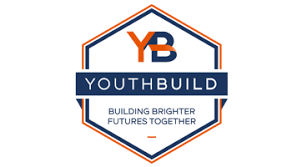 YouthBuild logo with a hexagon outline, large orange and navy YB at the top, and the words YOUTHBUILD and Building Brighter Futures Together in navy and orange text.